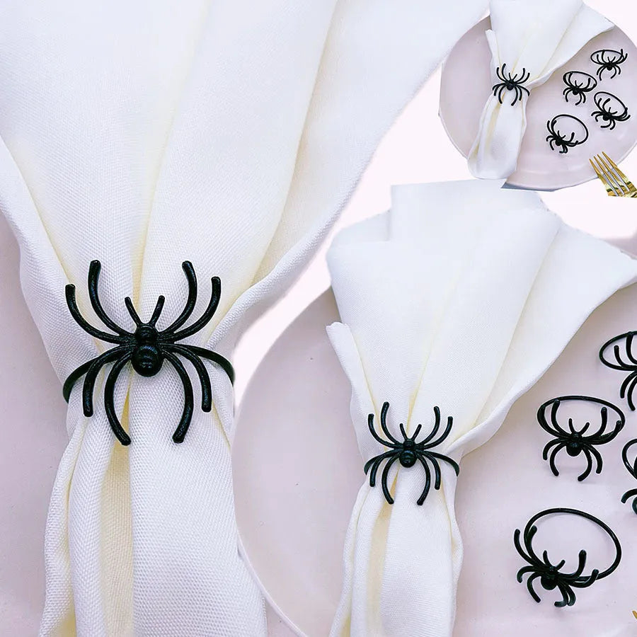 Set of six black spider patterned alloy napkin rings for Halloween table decoration