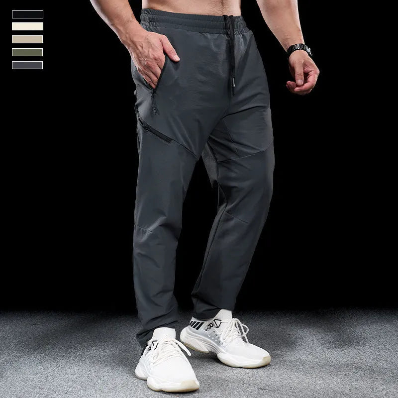 Men's waterproof quick-drying exercise trousers in nylon fabric for sports and fitness