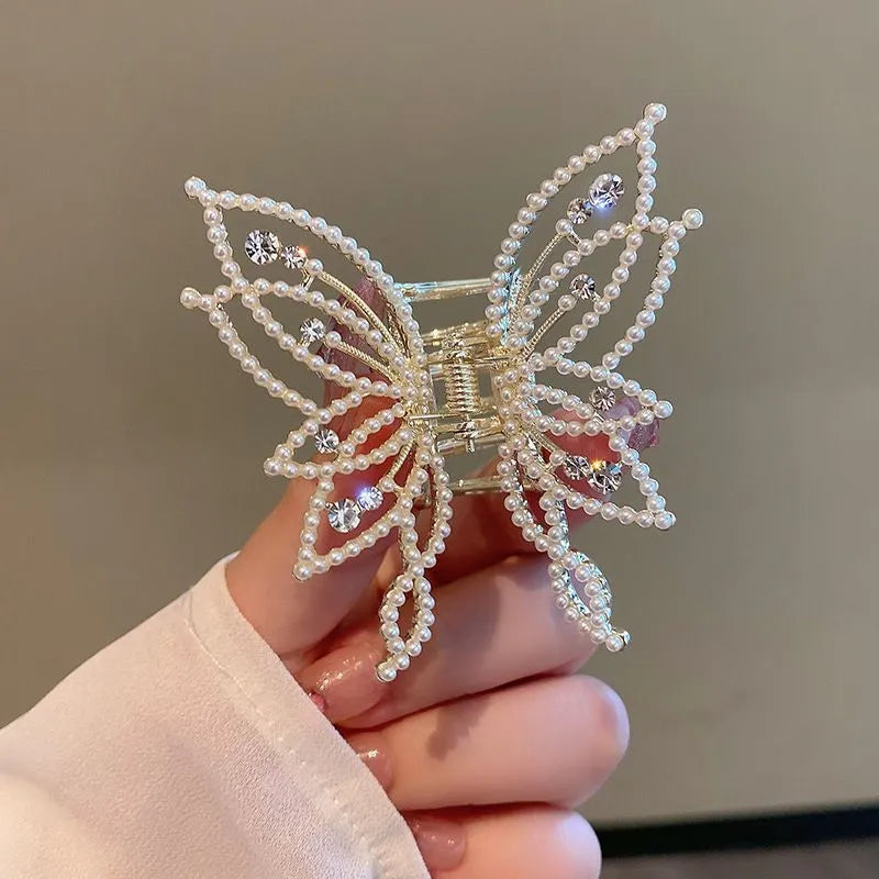 Alloy butterfly hair barrette clip with electroplated finish, shown in rhinestone and pearl style options