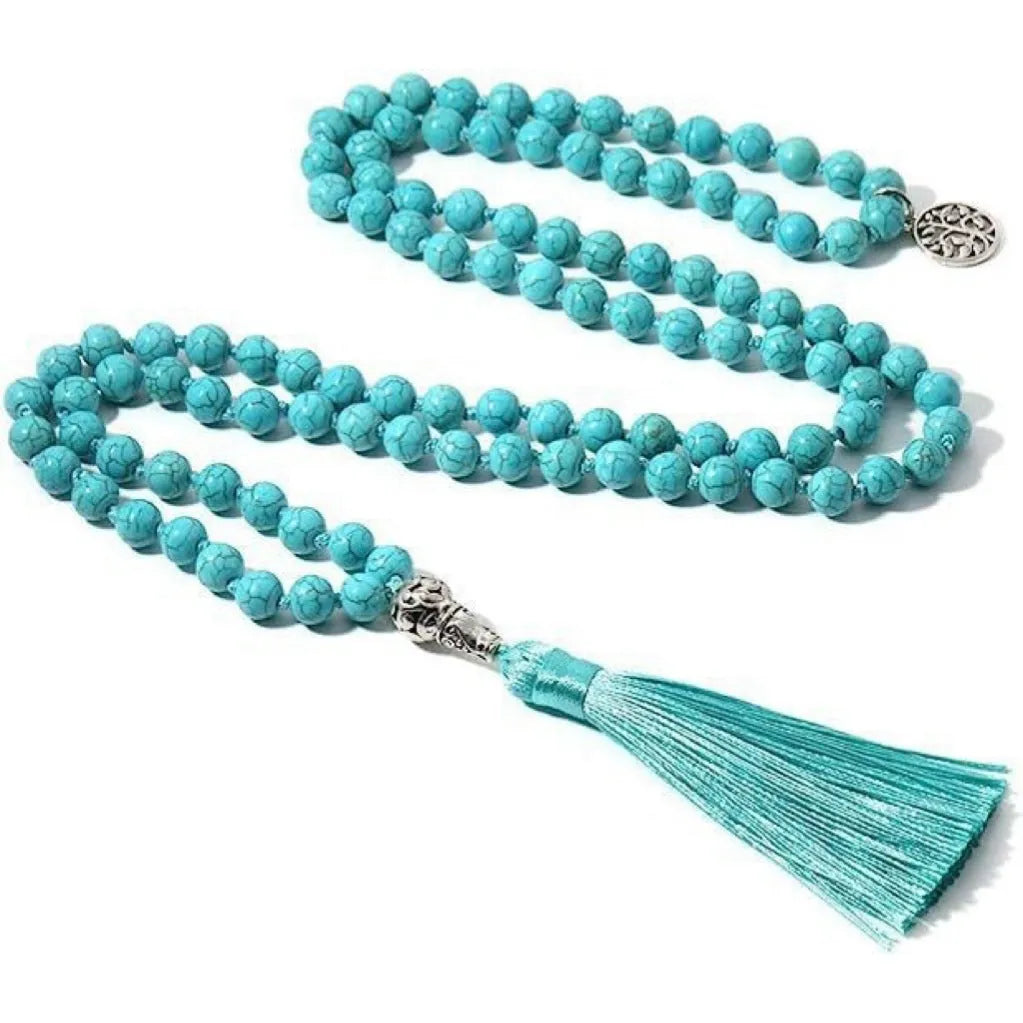 Handmade knotted beaded necklace with geometric stone pendant in natural colours.