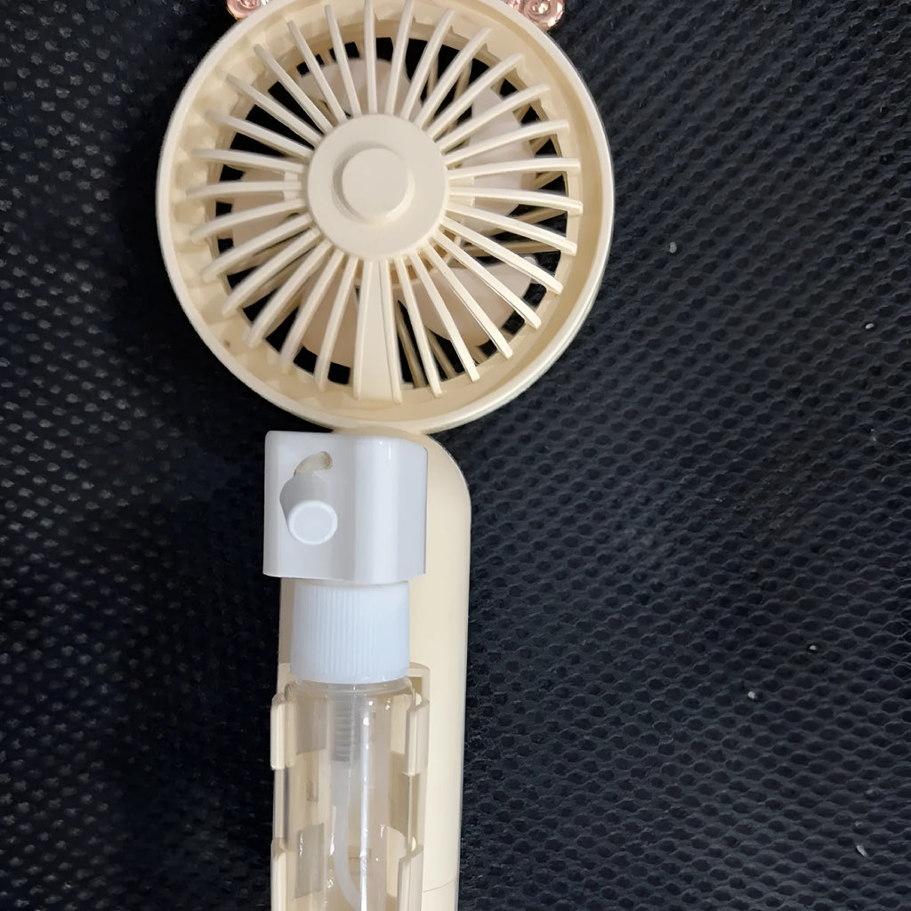 Compact plastic USB desk fan in choice of colours: apricot, blue, green, orange, or pink.