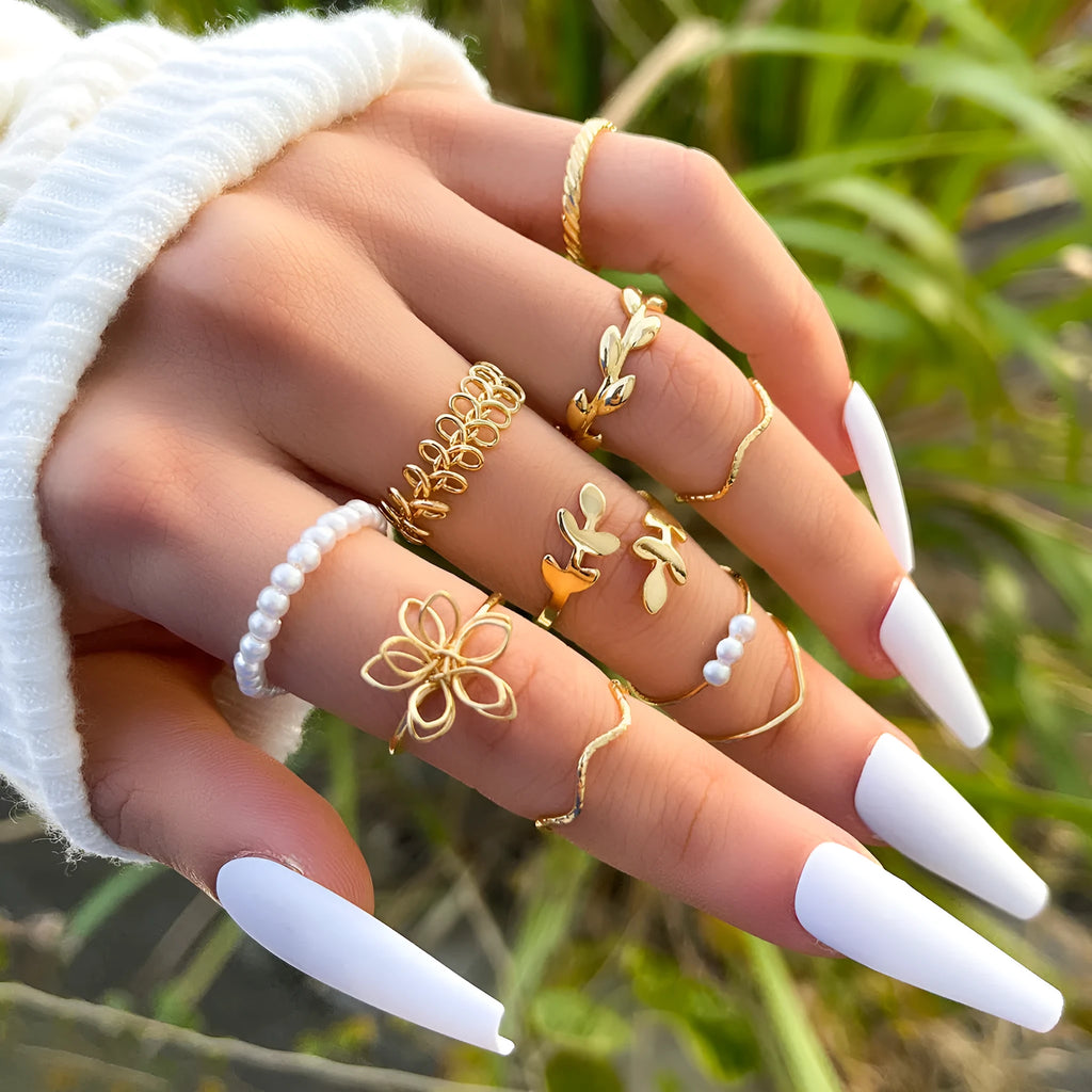 Gold colour openwork flower set ring with detailed floral design and glossy electroplated finish