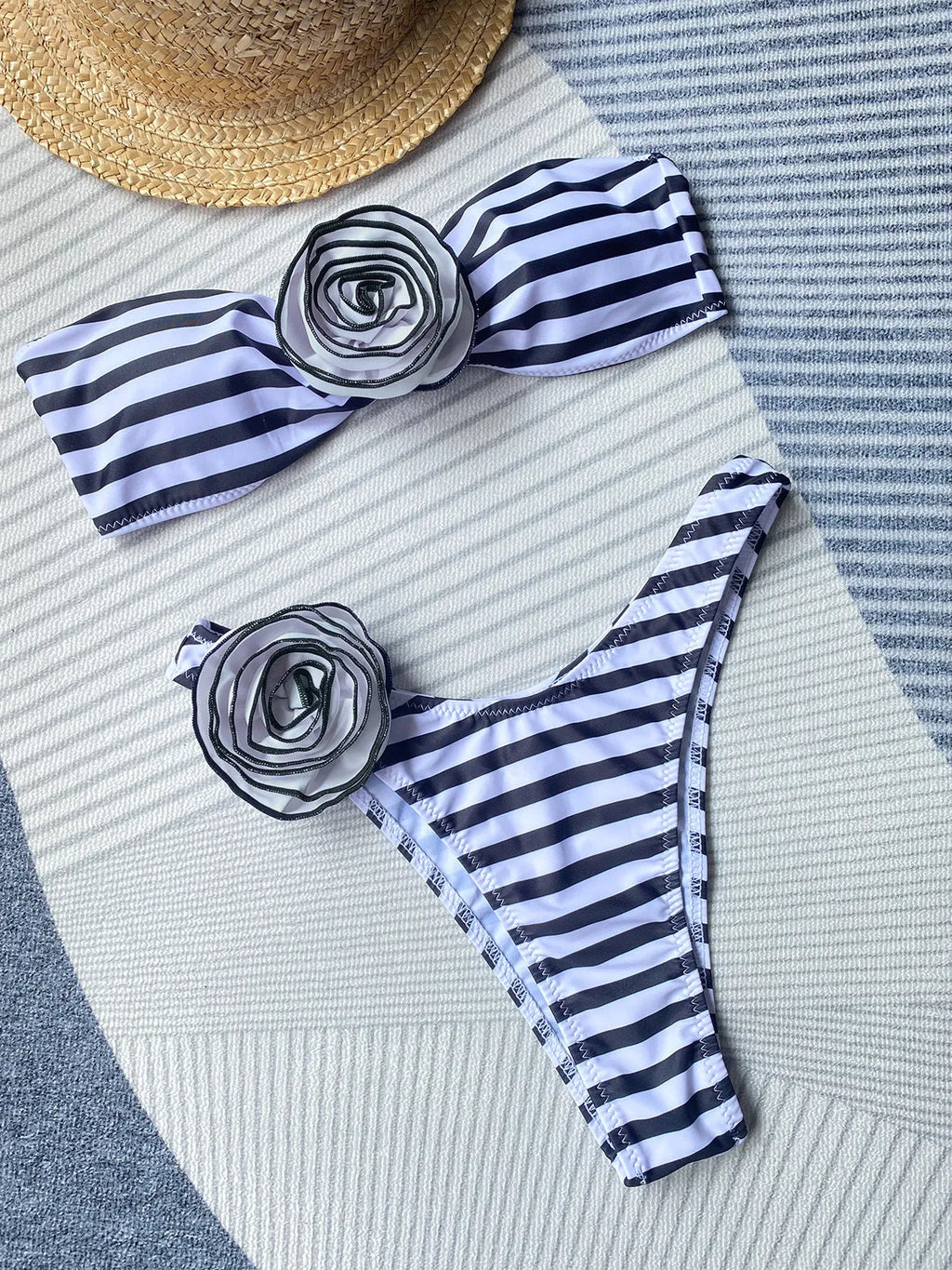 Black split-design bikini set with tube top and shorts on a mannequin