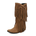 Women's beige suede high boots with tassel detail, chunky heel, and square toe on a waterproof platform sole.