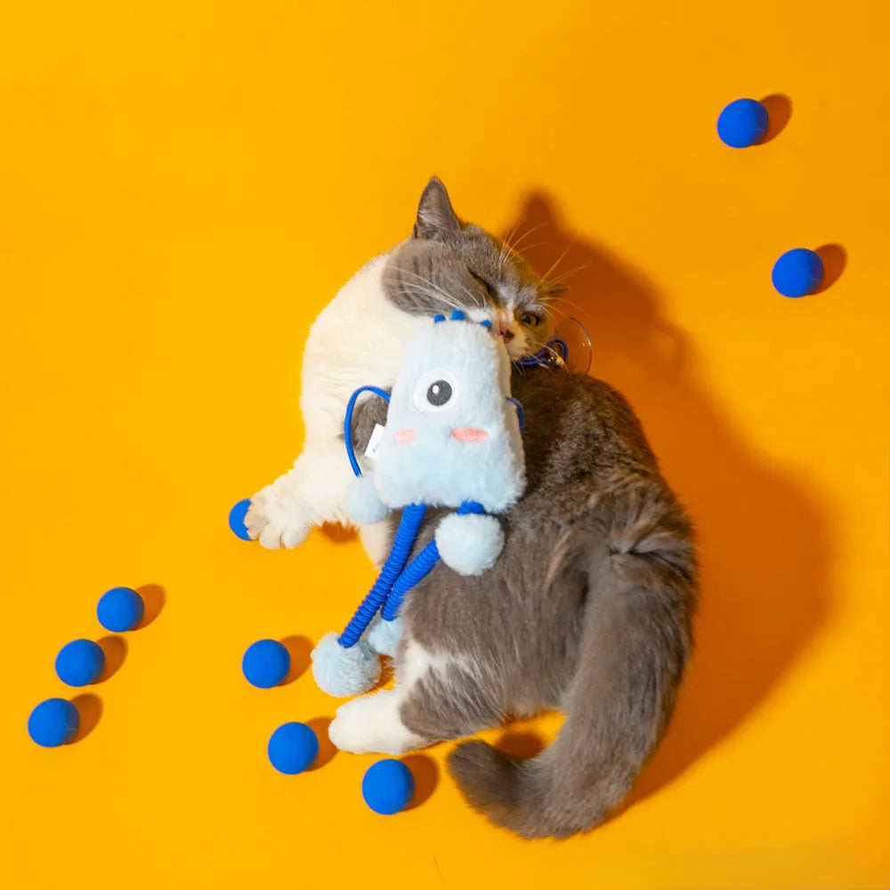 Mint coloured plush ring cat toy on a telescopic elastic rope with a bell inside the ring.