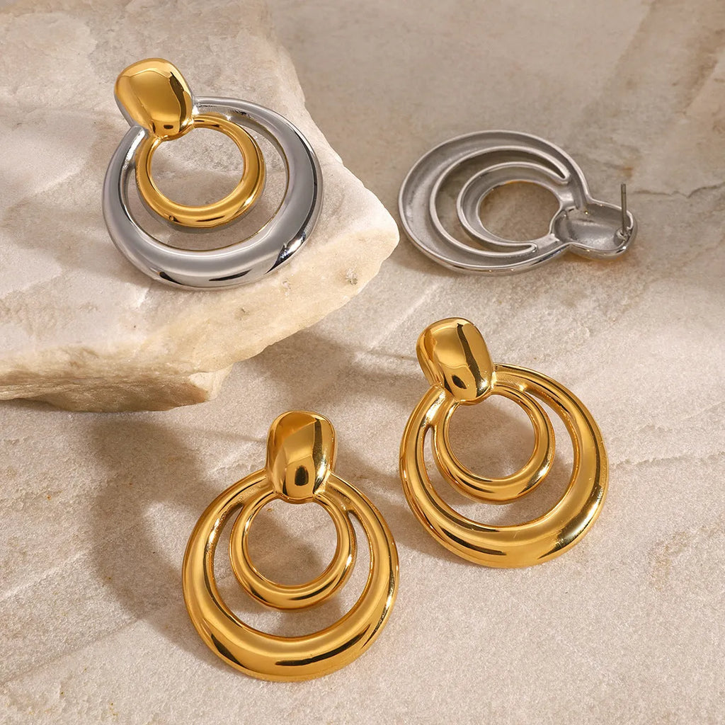 Golden round double layer hollow stud earrings with geometric design and hypoallergenic titanium steel construction