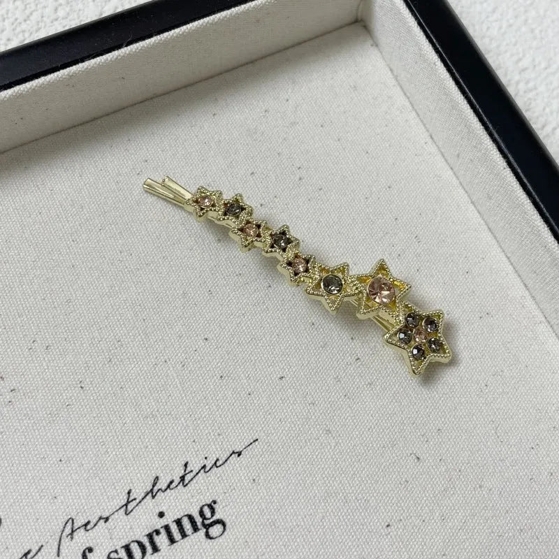 Gold electroplated rhinestone hair clip with Korean style star design for bangs