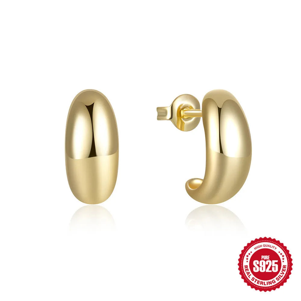 A pair of glossy C-shaped stud earrings in sterling silver, shown in both gold and white gold electroplated finishes.