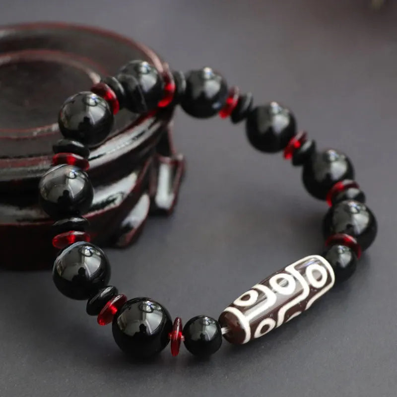 Black agate dzi bead bracelet with 11mm geometric beads in hand-woven unisex design