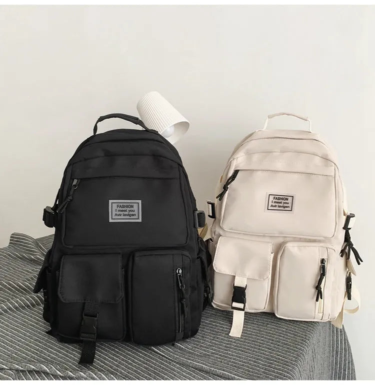 Black and white nylon student backpack with laptop compartment and external pockets
