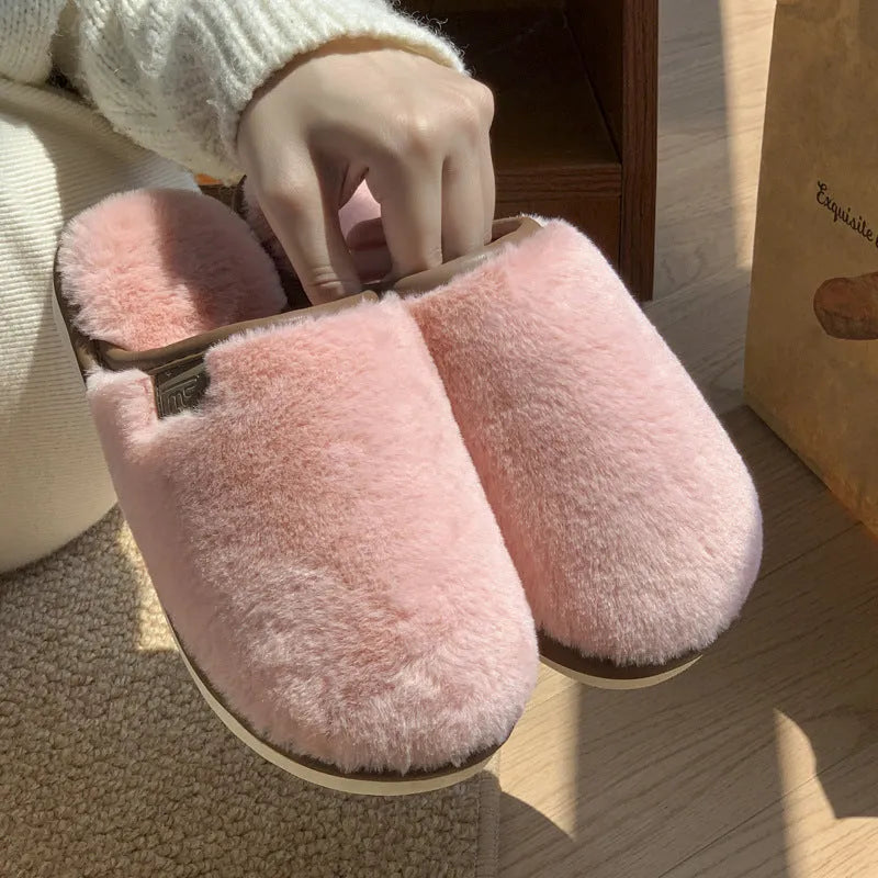 PVC winter plush slippers in solid colours with non-slip soles and car stitching detail