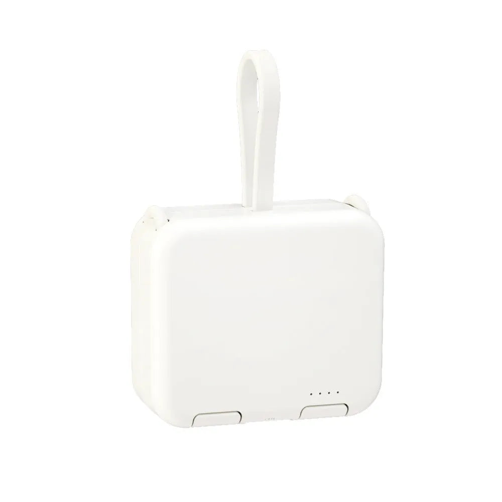 Handbag clip-on power bank in blue with a phone standing upright in its integrated stand.