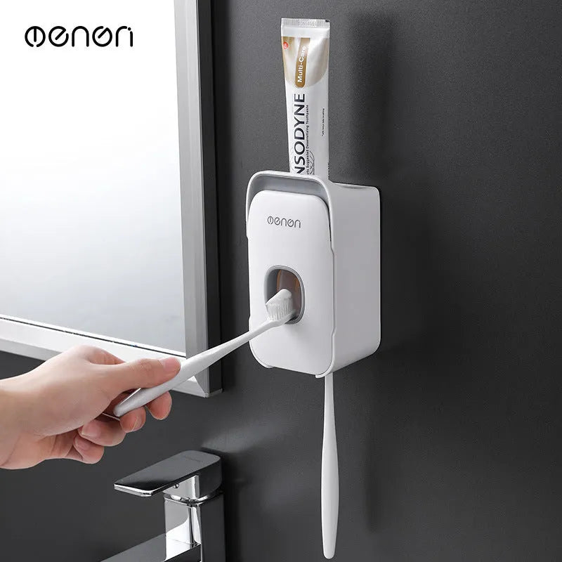 Automatic touchless toothpaste dispenser with digital LCD display mounted on a bathroom wall