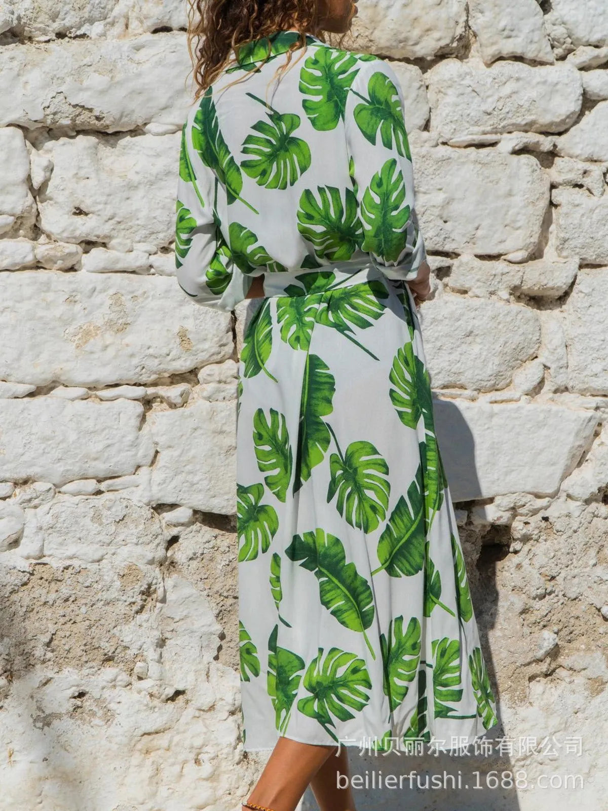 Women's black printed chiffon V-neck dress with an A-line skirt and conventional sleeves.