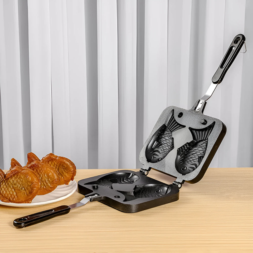 Black aluminium alloy non stick snapper burning mold with irregular sea bream shape for household waffle maker, 37.5 cm x 19 cm x 4 cm packaging.