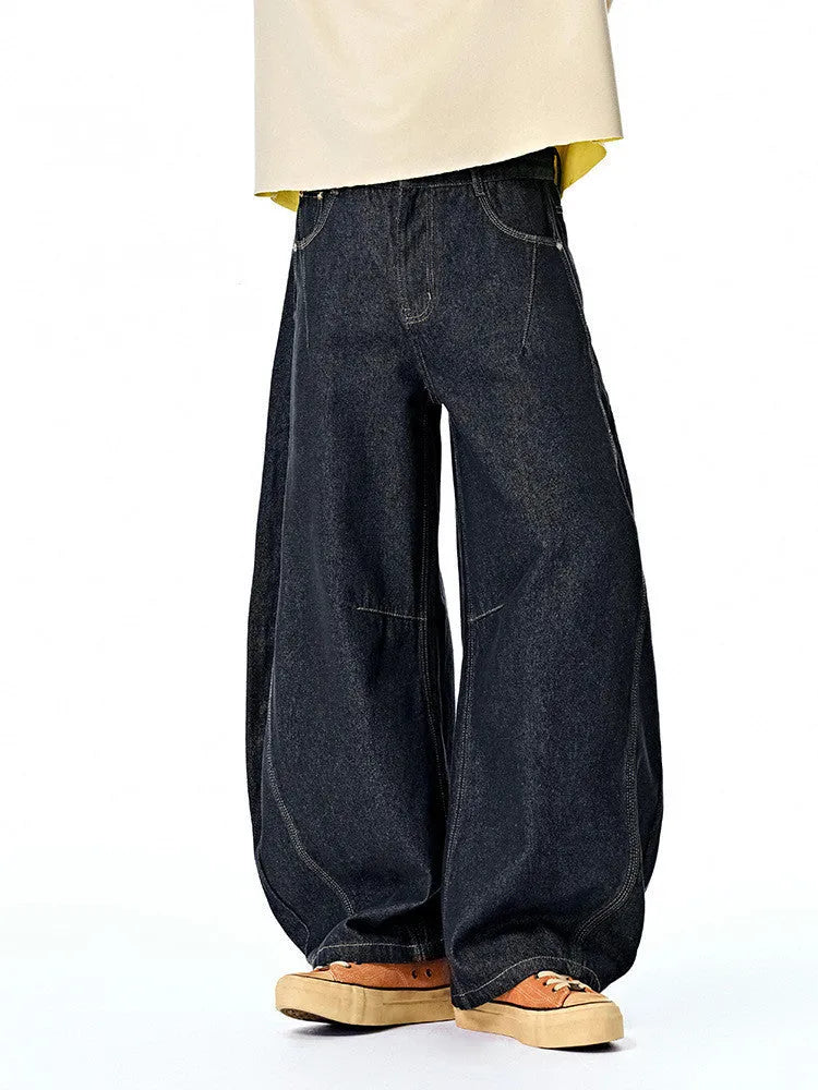 Men's original cow colour wide leg denim trousers on a mid-waist model.