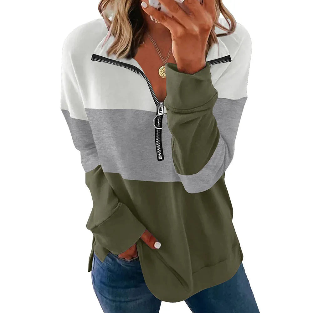 Women's loose-fitting long-sleeved leopard print pullover sweater on a hanger.