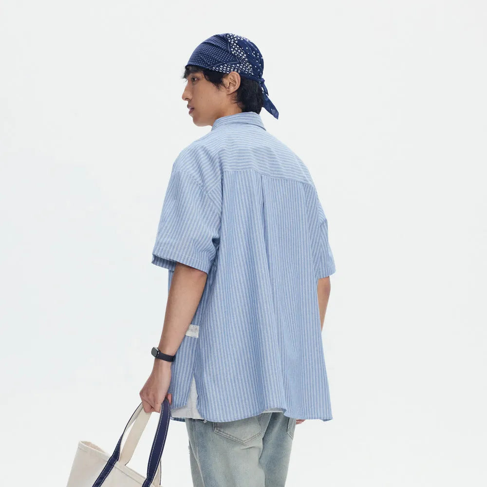 Blue and white striped loose-fitting short sleeve shirt cardigan style on hanger