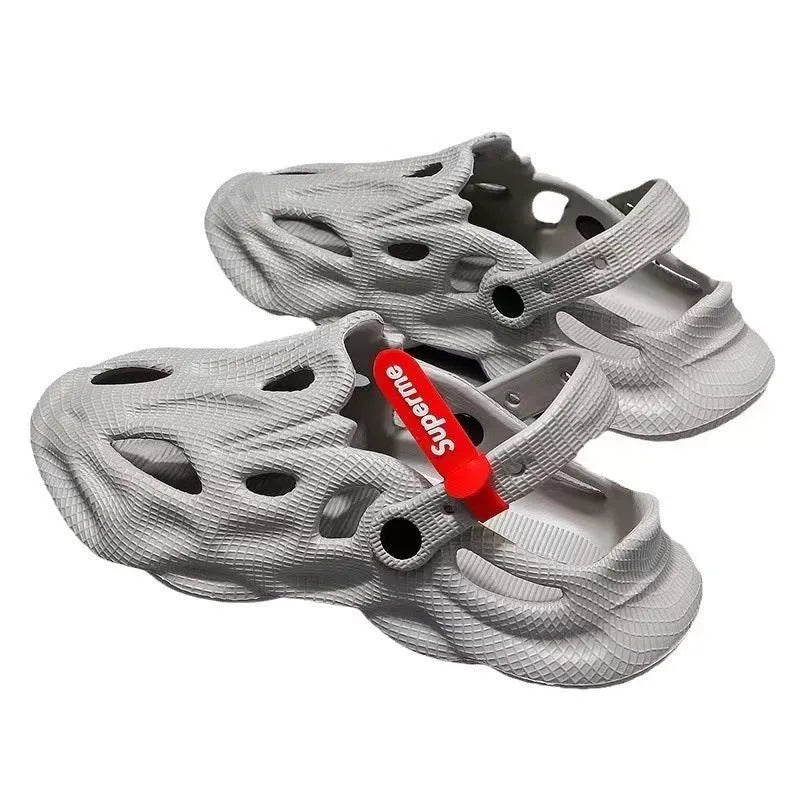 Korean style grey EVA closed-toe coconut slippers on a sandy beach background.