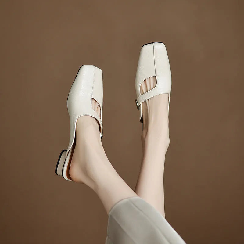 British style square toe leisure slippers in beige with a low heel and rubber sole.