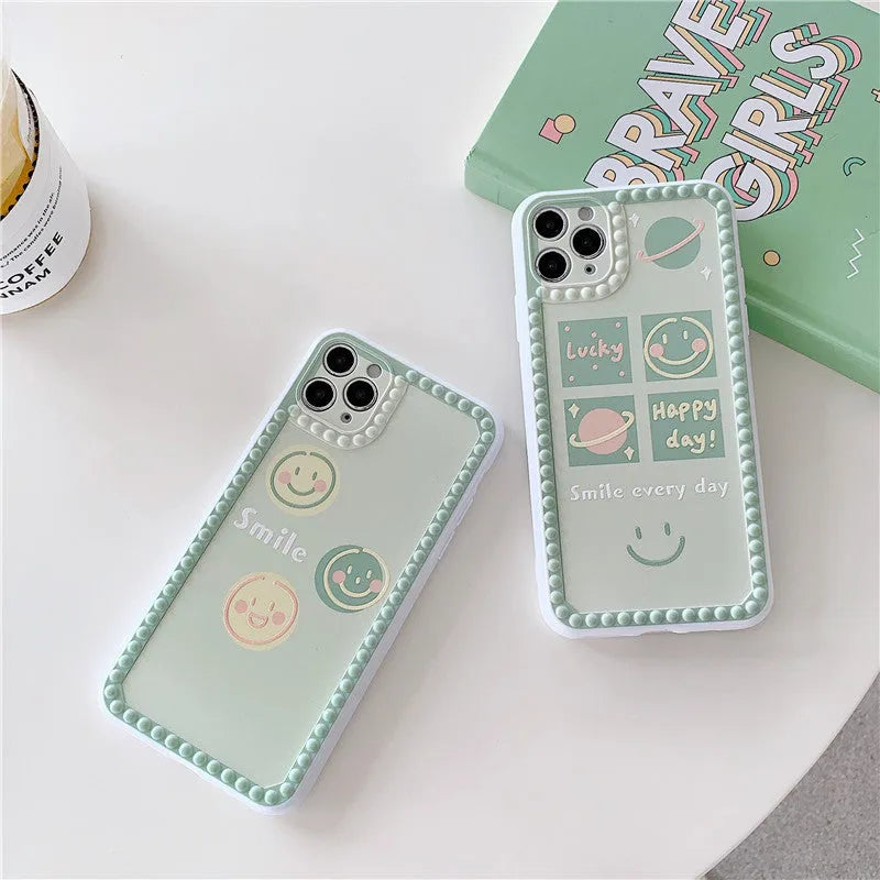 Green TPU iPhone case with geometric smiley face design, shown in polka dot frame and square grid styles.