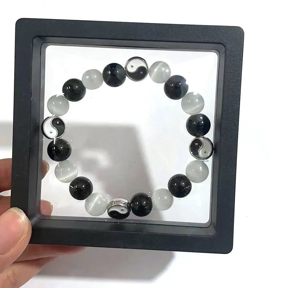Natural stone Tai Chi bracelet with 10mm opal and black agate beads in traditional Chinese design