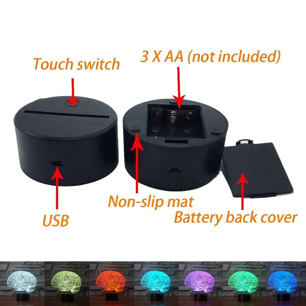 3D acrylic brain sculpture LED desk lamp with colourful illumination on a dark surface.