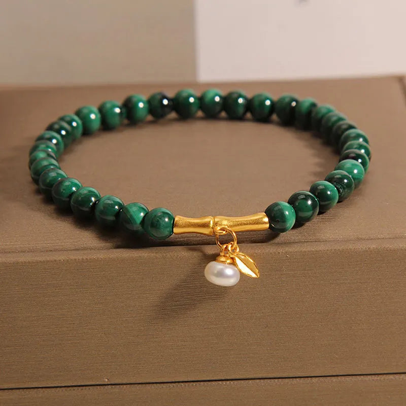 Women's white crystal bamboo bracelet showing adjustable design with bead arrangement