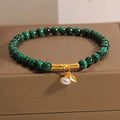 Women's white crystal bamboo bracelet showing adjustable design with bead arrangement