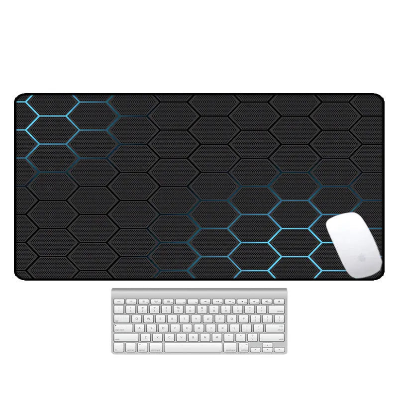 Large printed desk pad mouse mat with natural rubber non-slip base on a wooden desk.