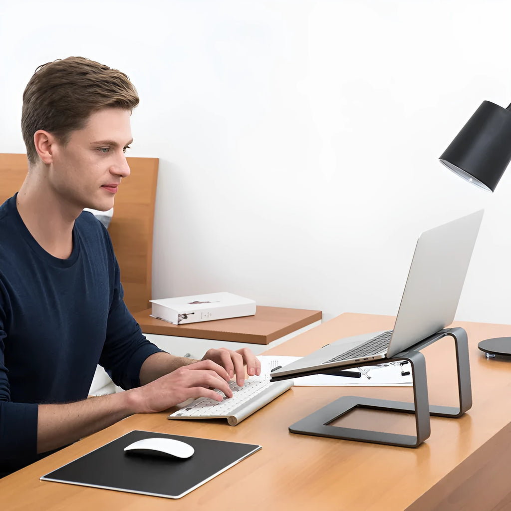 Black aluminium laptop stand elevating notebook with improved ventilation space underneath