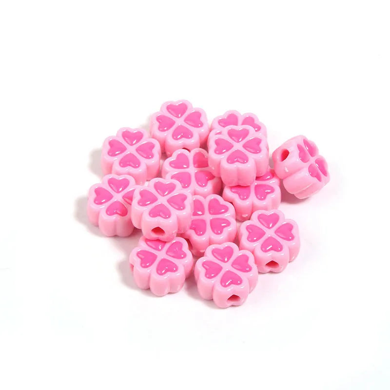 15mm acrylic clover-shaped beads with love pattern in multiple pastel colours including rose red, pink, yellow, green, blue, and purple
