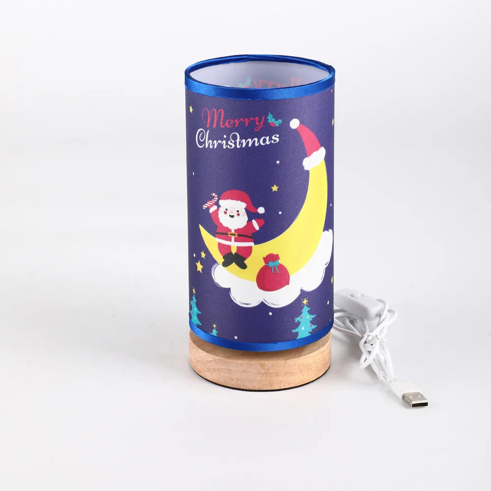 Moon-shaped Santa Claus LED night light with USB plug on bamboo base.