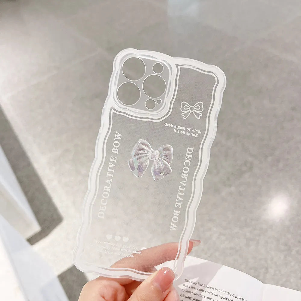 Transparent iPhone mobile phone case with a three-dimensional white bow design on the back.