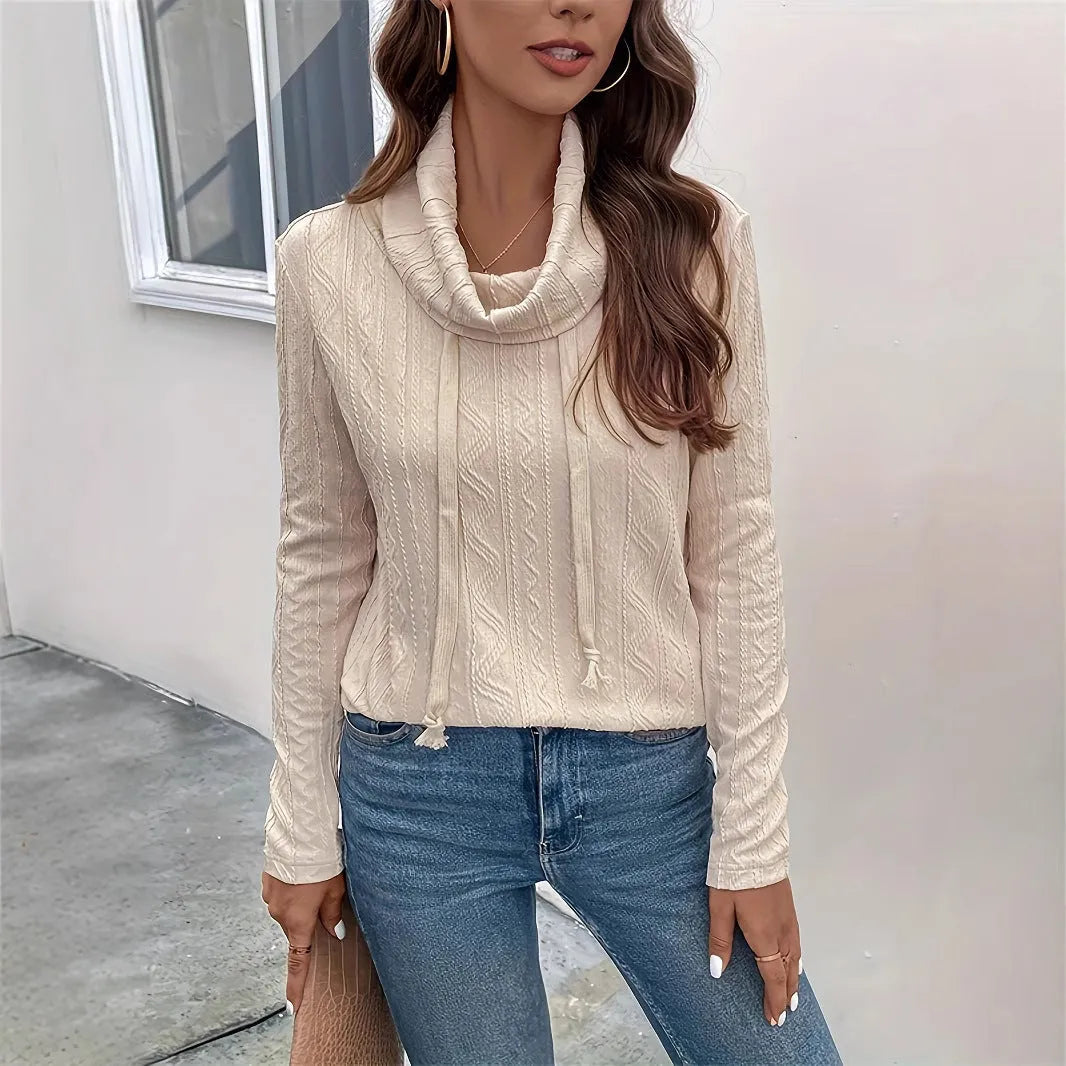 Apricot coloured hooded pullover sweater with long sleeves and drawstring adjustment