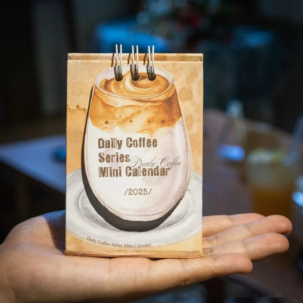 Mini paper desk calendar for 2025 with simple modern design and themed options