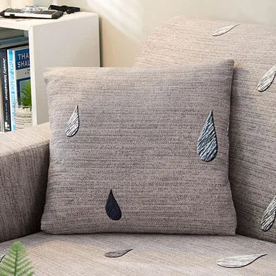 Geometric pattern stretch sofa slipcover on double seat sofa with matching cushion