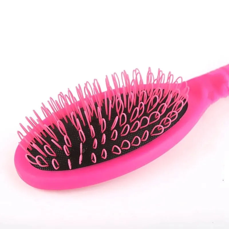 Black or pink plastic ring tooth hair extension comb measuring 22cm long