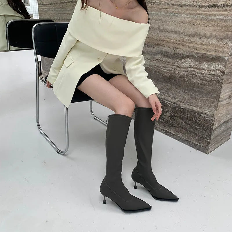 Women's black pointed toe below-knee boots with stiletto heel and back zipper