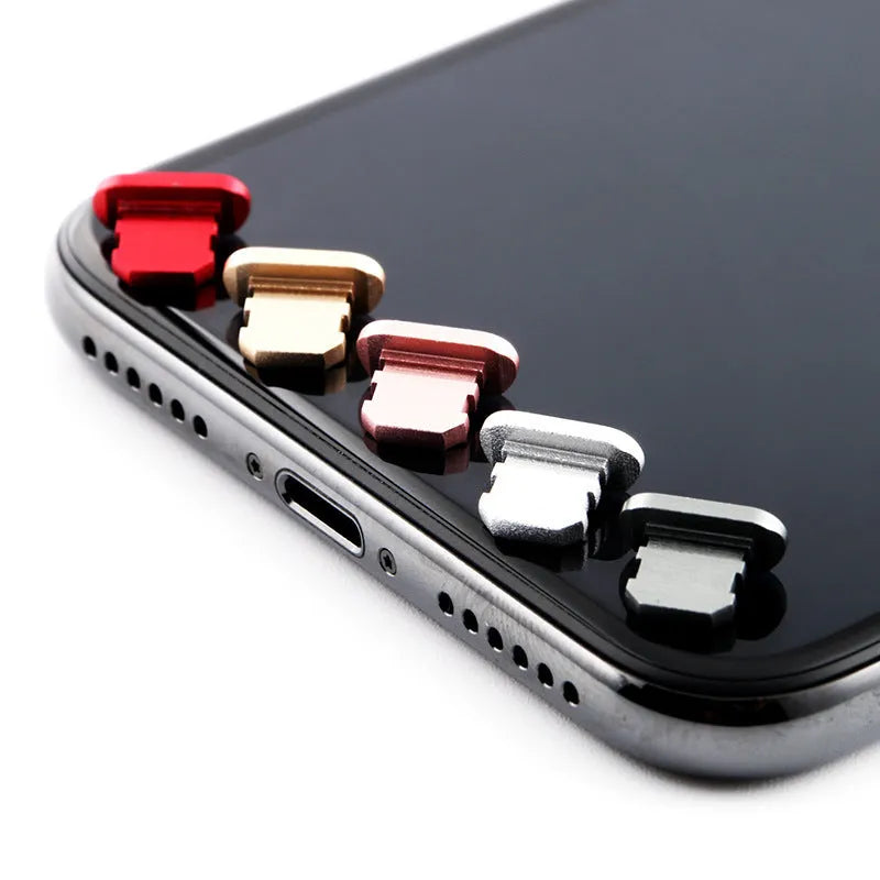Aluminium alloy dust plug for iPhone charging port in various colours including gold and rose gold.