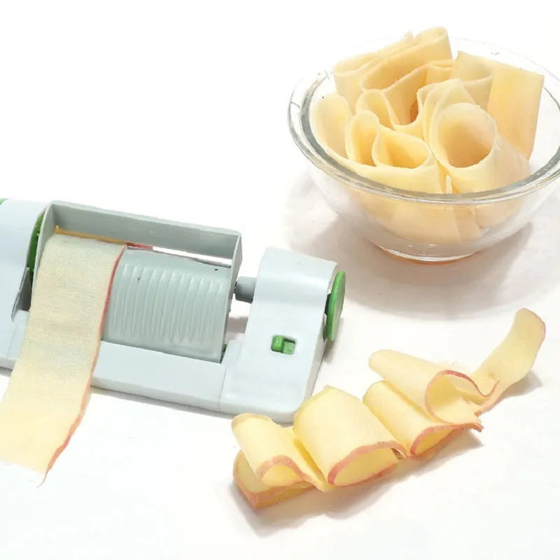 Green and white ABS and PP plastic kitchen multifunctional fruit slicer, 22.5cm by 10.5cm by 5.5cm