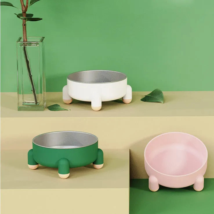 Green stainless steel non-slip pet bowl with anti-overturn high foot design for dogs and cats.