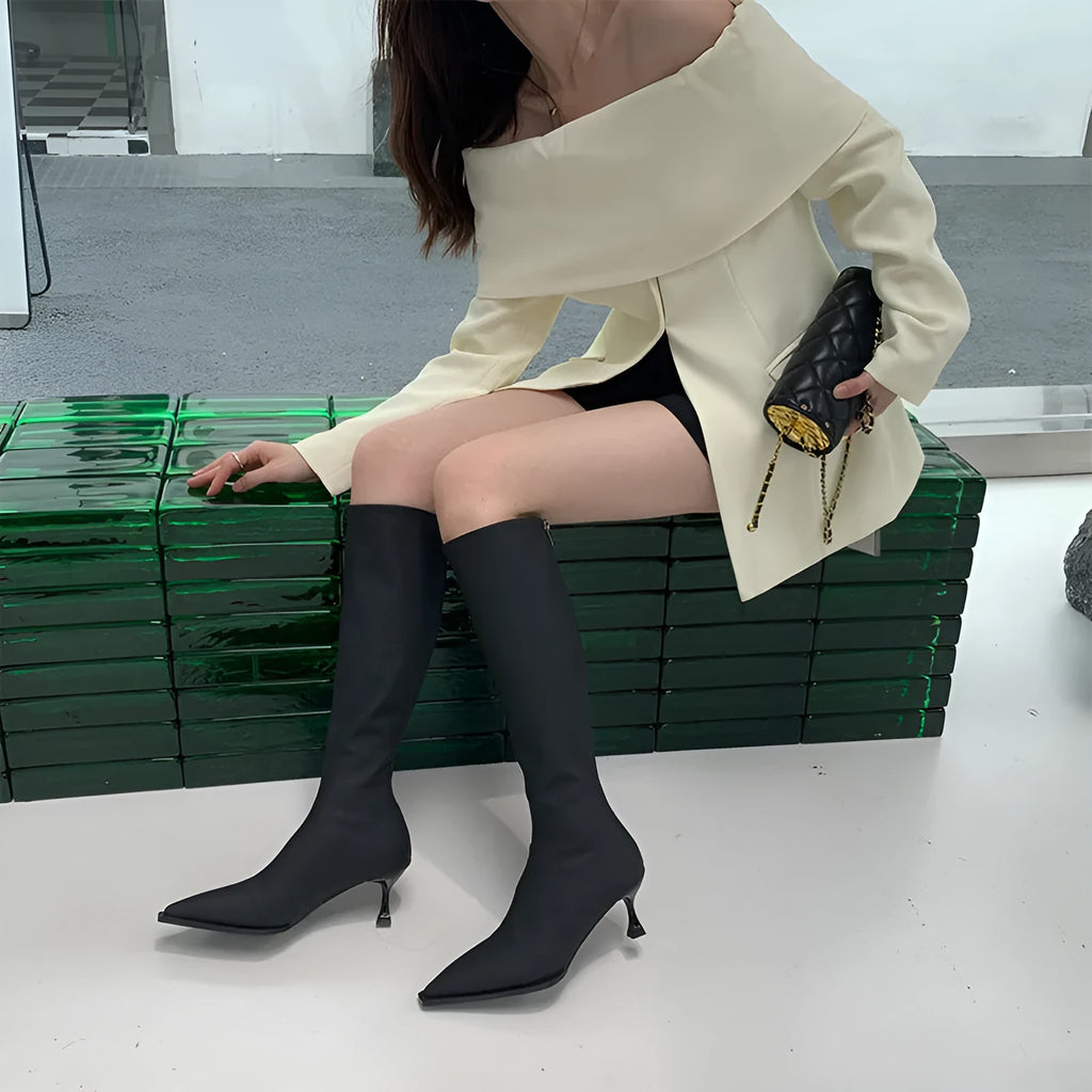 Women's black pointed toe below-knee boots with stiletto heel and back zipper