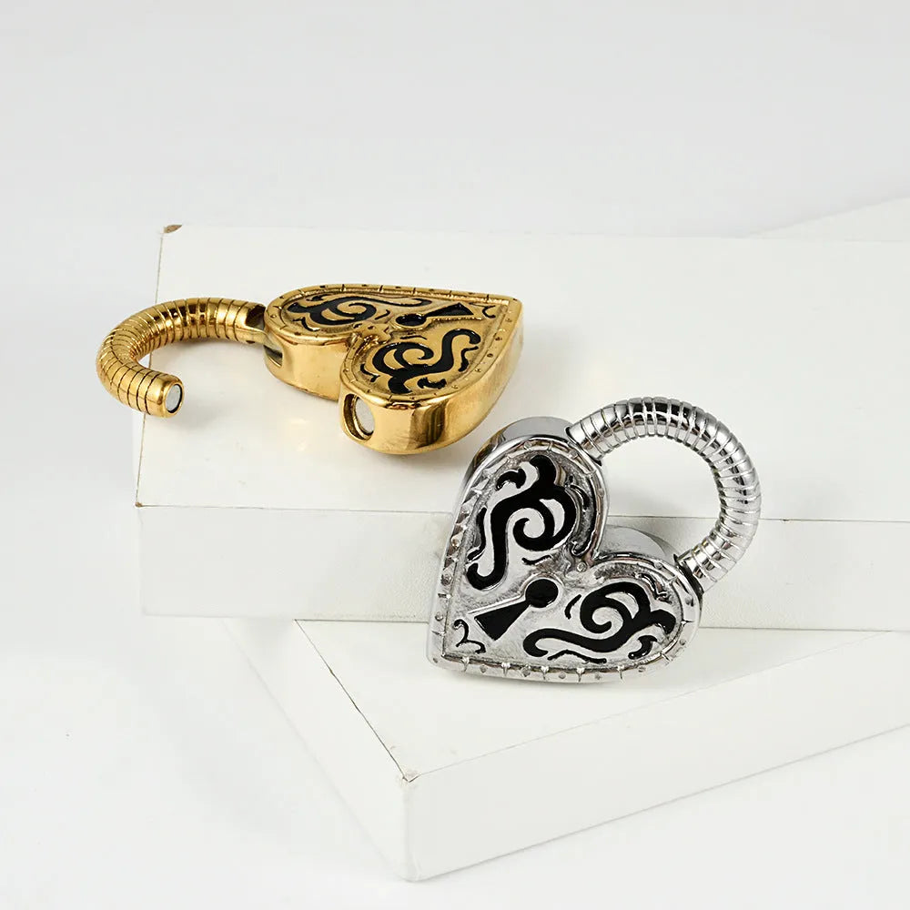 Women's heart-shaped stainless steel earrings in gold and steel colour options.