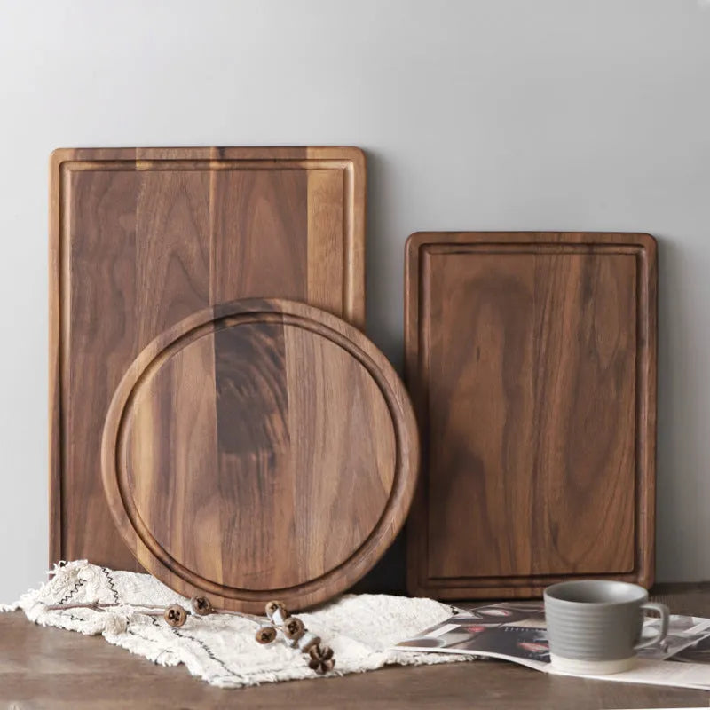 Black walnut wood cutting board with juice groove and engraved handle in three size options