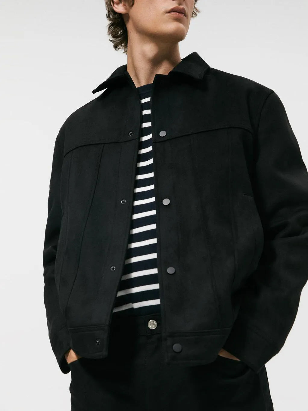 Men's black hooded jacket with suede collar showing loose sleeves and straight hem