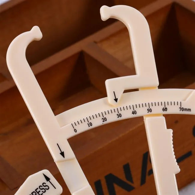 Acrylic fat caliper body fat measuring instrument showing measurement scales and 200mm range