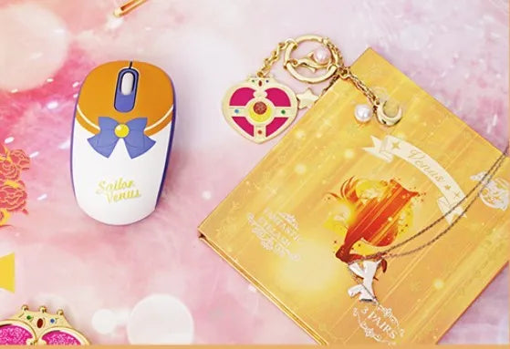 Sailor Moon cartoon themed pink wireless computer mouse with USB receiver.