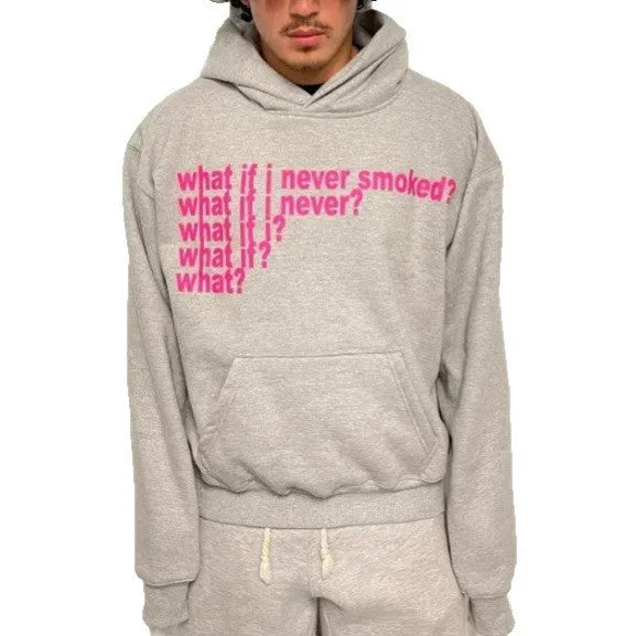 Black hooded sweater with white letter print on front, model wearing size M.