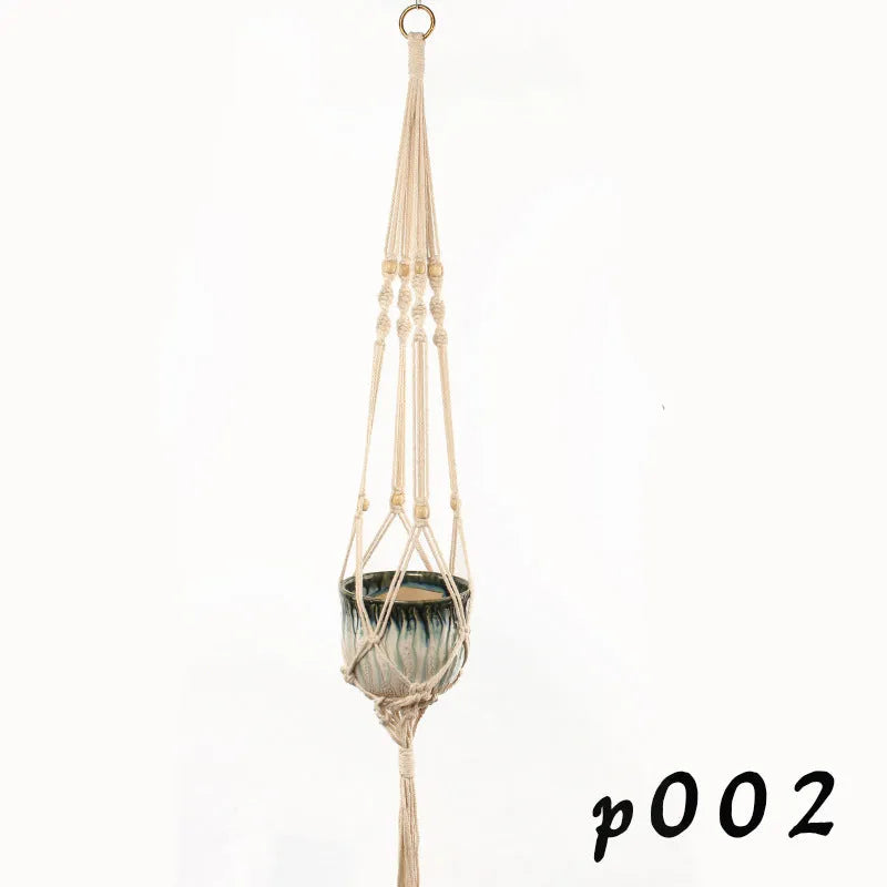 Woven cotton rope plant hanger in wall hanging configuration with green plants